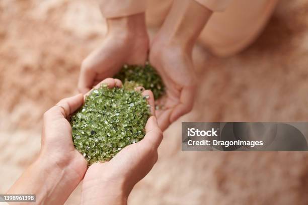 Woman Holding Handful Of Nurdle Stock Photo - Download Image Now - Environmental Conservation, Granule, Plastic