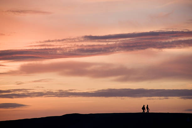 Wanderers in the light of Sunset stock photo