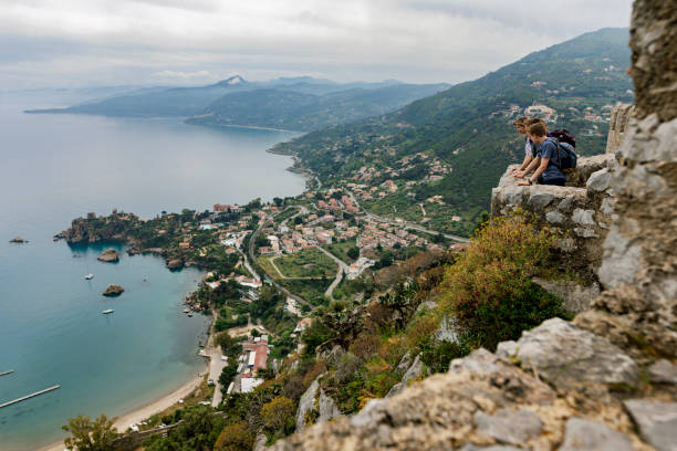 Family hiking on the hill above city of Cefalu, Sicily Mother and three teenage kids are hiking in Sicily, Italy. They have walked up the hill near the town of Cefalu. They are looking at the beautiful view of the sea, the town and the Sicilian mountains.
Canon R5 cefalu stock pictures, royalty-free photos & images