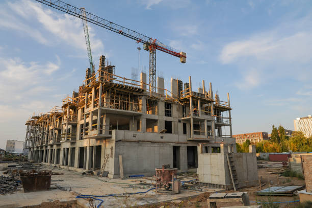 istock Construction site of modern apartment building on a sunset. 1398962614