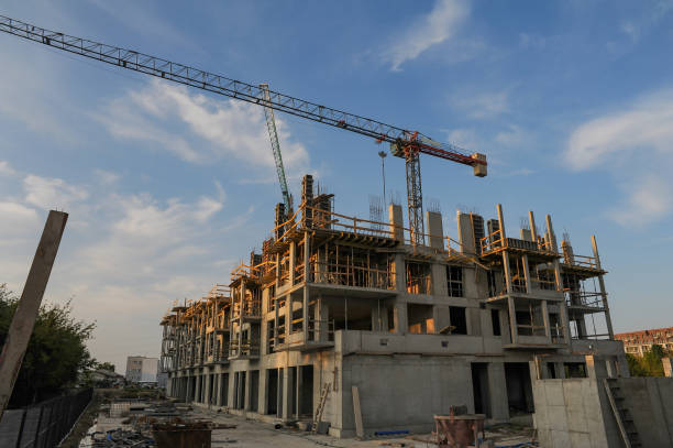 istock Construction site of modern apartment building on a sunset. 1398962636