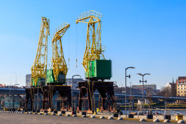 istock Old cranes on city boulevard in Szczecin, Poland 1398962941