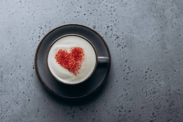 istock Shot from above on a cup of coffee with a heart pattern 1398964070