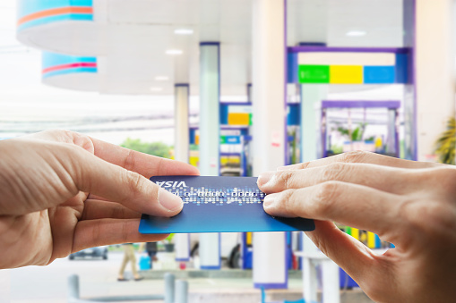 Credit card to make a payment for refueling car on gas station