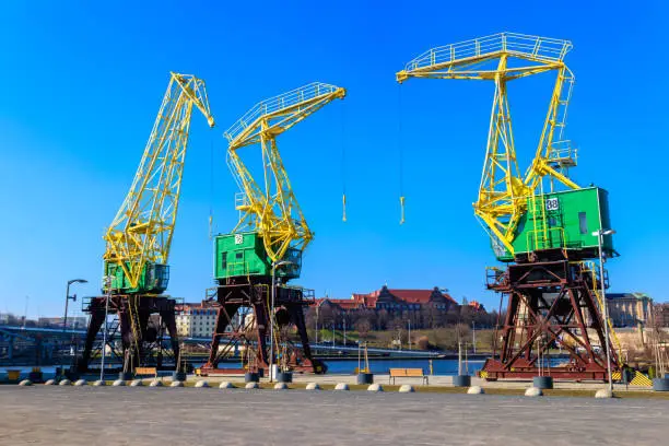 Old cranes on city boulevard in Szczecin, Poland