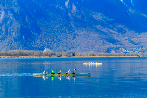 Montreux, Switzerland - April 10, 2022: People kayaking on lake Geneva in Montreux, Switzerland