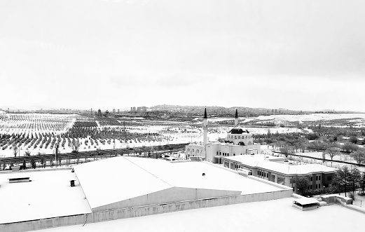 Snow landscape in the modern city. winter month.