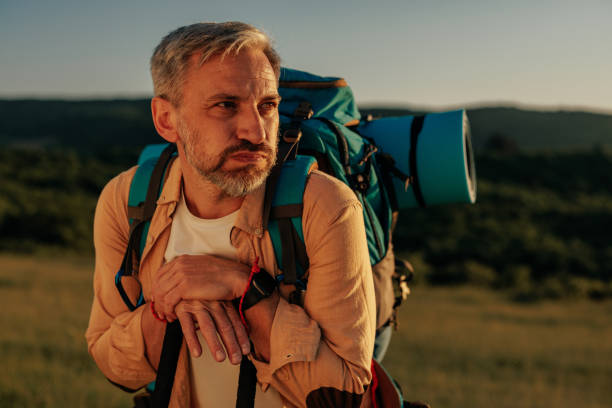 istock Male hiker resting while hiking on mountain 1398965518