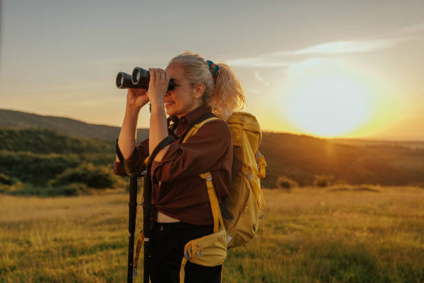 istock Woman with binoculars during her hiking adventure 1398965520