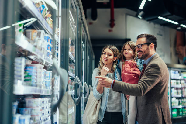 istock Parents and daughter shopping together 1398965572