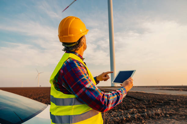istock Male engineer in the helmet using digital tablet 1398965640