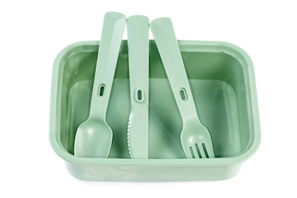 istock Plastic cutlery in empty food storage container on white background 1398965820