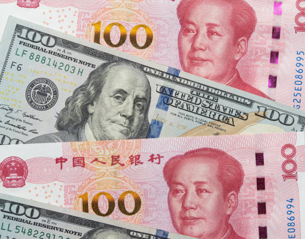 istock US. Dollar and Chinese Yuan Note Background 1398966215