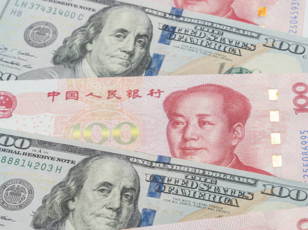 istock US. Dollar and Chinese Yuan Note Background 1398966987