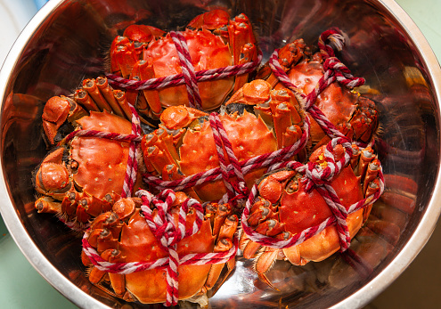 Top view of Cooked crab or blue crab menu Seafood steamed crab on a white wooden background