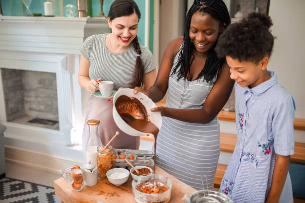 istock Multiracial family making doughnuts in the kitchen 1398969716