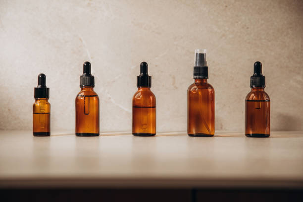 istock Clear bottles with natural SPA cosmetics on a beige stone background 1398970465