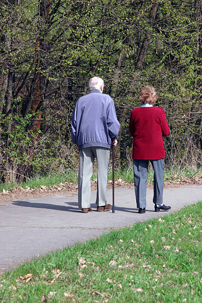istock senior couple walking together 139897114