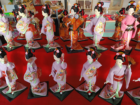 beautiful japanese dolls group on red background