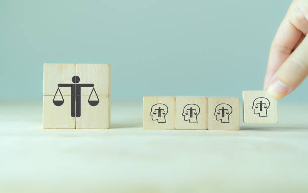 istock Ethical corporate culture concept. Ethics inside human mind. Business integrity and moral. Putting wooden cubes with ethics inside a head standing with  ethical corporate. Sustainable business. 1398972038