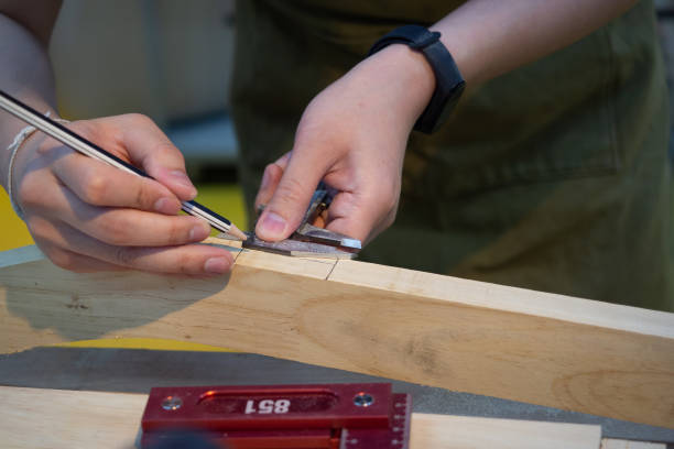 istock Carpenter working on woodworking on workbench in carpentry shop. 1398973213