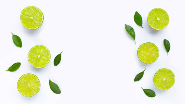 istock Limes with leaves isolated on white. 1398973728