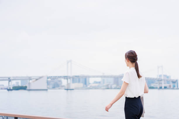 istock Businesswoman walking outside without jacket 1398975503