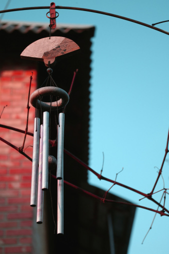 Windchimes blowing on the wind produce beautiful sounds and heart softening chimes.