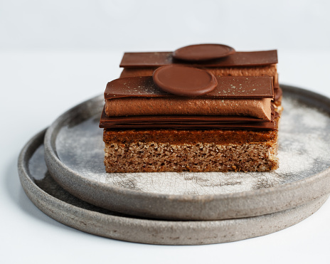 Chocolate layered cake with praline, ganache, almond dacquoise