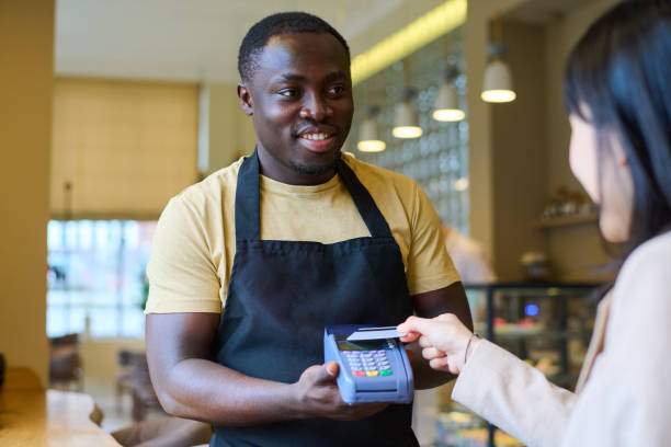 istock Paying with credit card in restaurant 1398977130