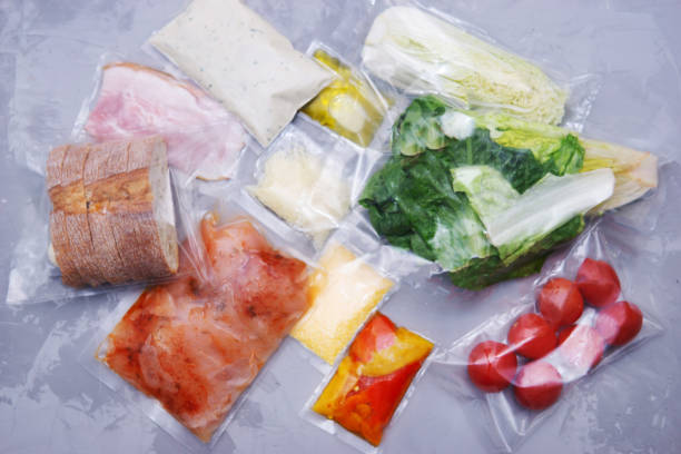 istock Salad dinner set: chicken, lettuce, tomatoes, peking cabbage, cheese, bacon, bread, olive oil sauces and spices. A set for delivering food for dinner on a gray background. I cook at home. 1398978721