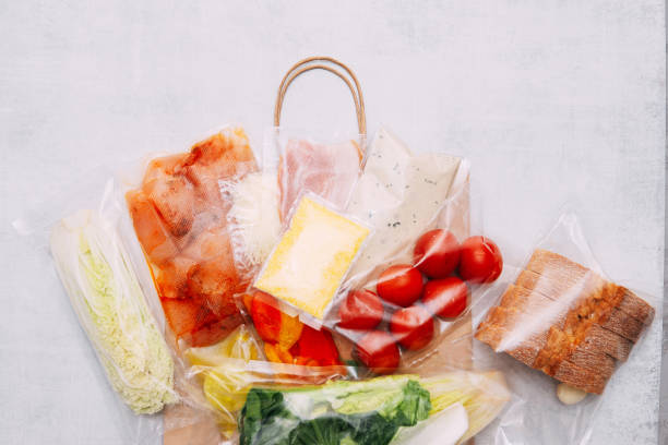 Salad dinner set: chicken, lettuce, tomatoes, peking cabbage, cheese, bacon, bread, olive oil sauces and spices. A set for delivering food for dinner on a white background. I cook at home.