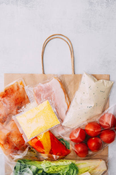 istock Salad dinner set: chicken, lettuce, tomatoes, peking cabbage, cheese, bacon, bread, olive oil sauces and spices. A set for delivering food for dinner on a white background. I cook at home. 1398978771