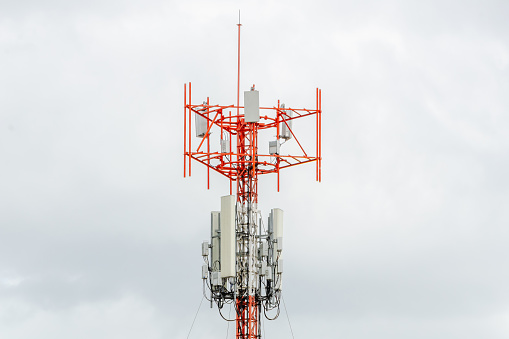 Telecommunication tower of 5G and 5G cellular. Macro Base Station. 6G radio network telecommunication equipment with radio modules and smart antennas mounted on a metal