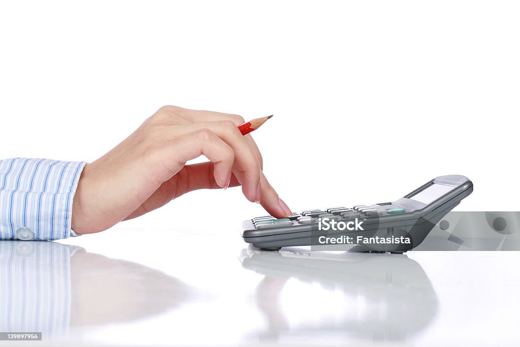 Bookkeeper. Calculator and hand isolated over white. Bookkeeping Stock Photo
