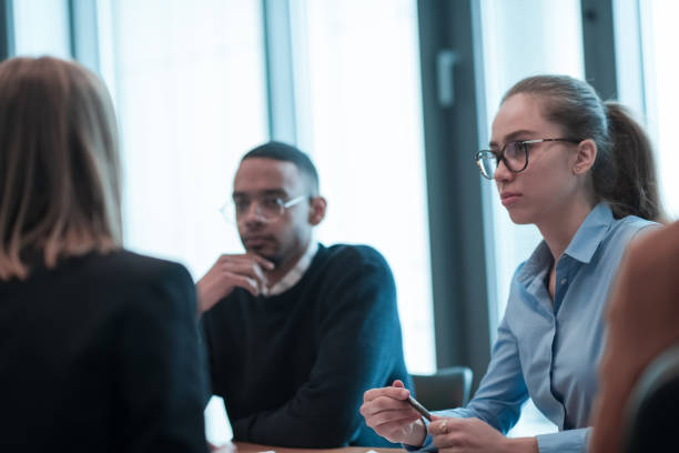 istock Successful team. Group of young multi-ethnic business people working and communicating together in creative office. Selective focus 1398980157