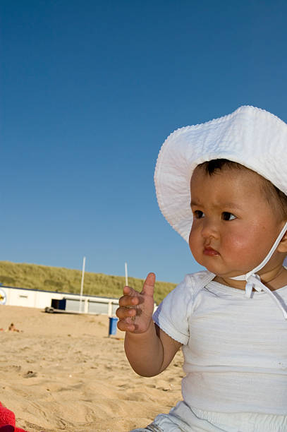 baby girl with hat stock photo