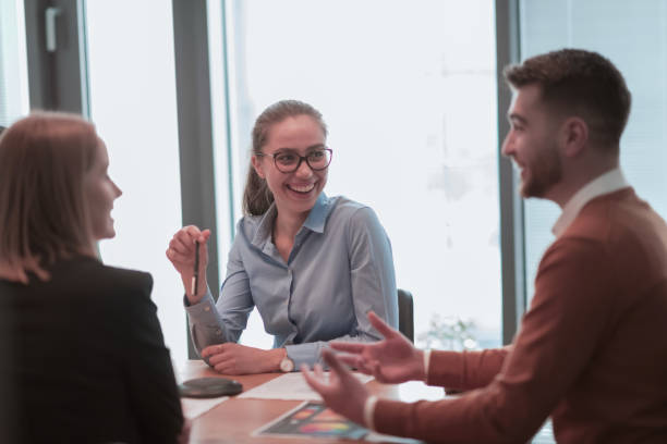 istock Successful team. Group of young multi-ethnic business people working and communicating together in creative office. Selective focus 1398981042