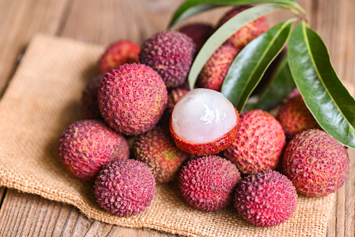 Fresh Lychee fruit on a wooden table