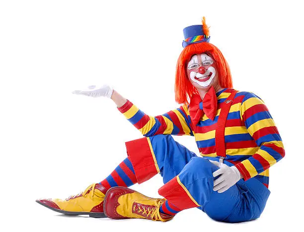 Sitting Male Clown Holding Out His Hand Ready to Hold Your Message or Product