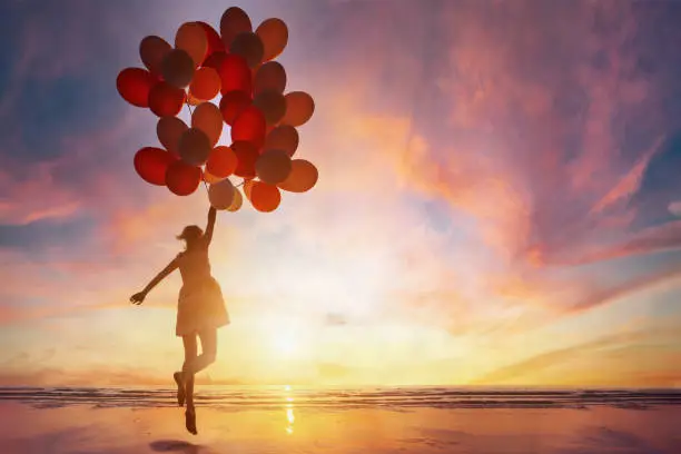 Photo of creativity and inspiration, woman with many balloons, motivation