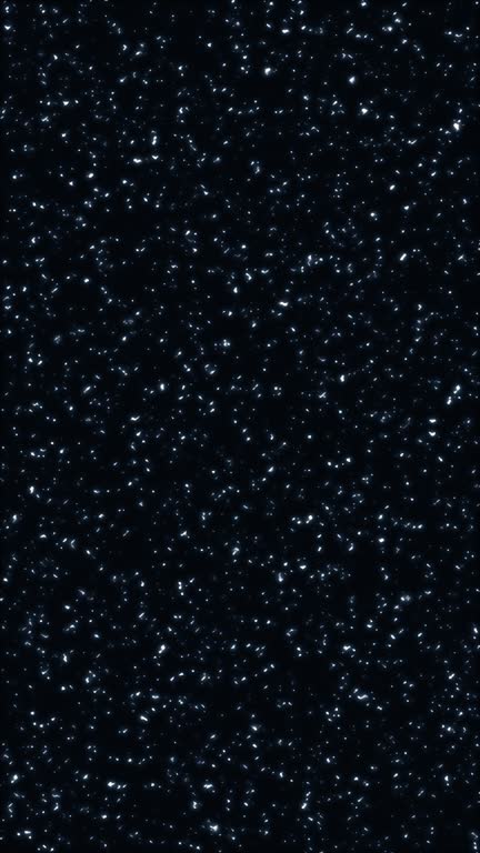 Space looking moving abstract background with small simmering defocused interferences. TV static on a black background. Perfect for a design of art projects and creative spaces
