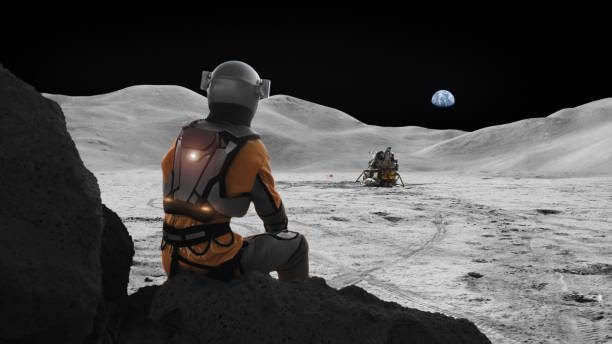 istock Astronaut stranded on the moon missing home. Distant planet Earth in the sky 1398989837