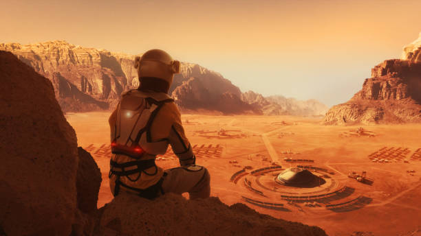 istock Astronaut on planet Mars watching a space station. Earth colony in Space 1398989846