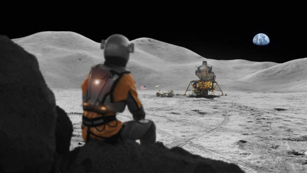 istock Astronaut exploring the moon. Distant planet Earth in the sky 1398989857