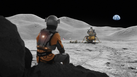 Traversing zero gravity environment. Surveying a colorless terrain of sand and rocks. Lunar outpost in the distance. Apollo Mission inspired. NASA Public Domain Imagery