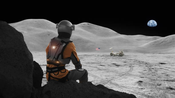 istock Astronaut exploring the moon. Distant planet Earth in the sky 1398989858