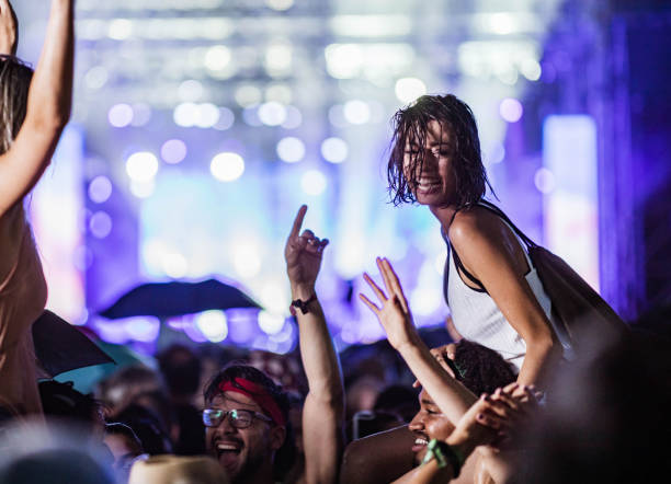 istock Dancing on music festival during rainy night! 1398990880