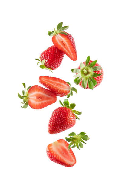 istock Whole and Sliced Fresh Strawberries in Air on White Background 1398990953
