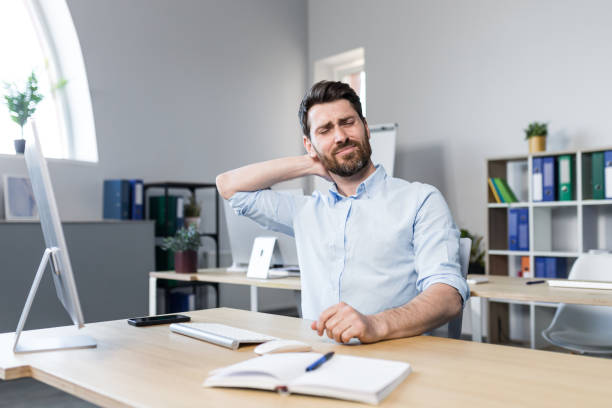 istock Businessman at work, tired has a severe neck pain 1398991065